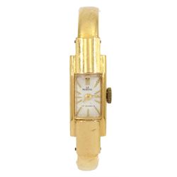 Martine ladies 18ct gold manual wind wristwatch, hallmarked, on 18ct gold hinged bangle, stamped 750
