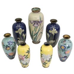 Three pairs of Japanese Cloisonne vases, each decorated with blossoming flowers, the blue ground vases decorated with wading storks, together with another Japanese Cloisonne vase, decorated with iris, H31cm max (7)