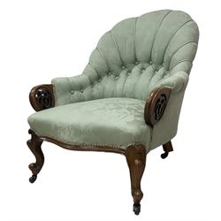 19th century mahogany framed fan-back armchair, upholstered in buttoned turquoise floral damask fabric with spring seat and pearlescent piping, pierced and carved arm terminals with floral motif, over serpentine fronted seat, raised on cartouche carved cabriole supports with castors