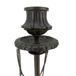 Pair of 19th century French patinated bronze candlesticks in the manner of Ferdinand Barbedienne, the gadrooned sconces hung with chains, reeded columns on tripod supports with hoof feet, H28cm 