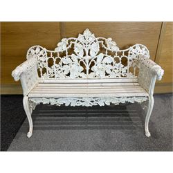 Coalbrookdale design - early 20th century cast iron oak leaf and acorn bench, white painted cast iron frame with slatted wooden seat, the pierced and shaped back decorated with scrolling oak branches and leafage, flanked by dog mask arm terminals over cabriole supports with paw feet 