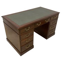 Late 19th century mahogany twin pedestal desk, moulded rectangular top with inset leather, fitted with nine drawers, on plinth base