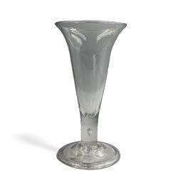 Large 18th century ale glass, circa 1780, with drawn trumpet bowl and flared rim, teardrop stem on a domed folded foot, H20cm