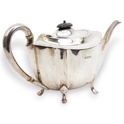 Silver oval teapot with ebonised lift, ivory insulators, loop handle and raised on four shaped supports and matching hot water jug Sheffield 1922/3 Maker Fenton Bros. Ltd. This item has been registered for sale under Section 10 of the APHA Ivory Act