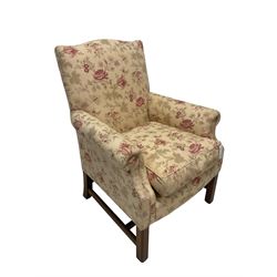 Peter Dudgeon - Georgian design mahogany framed armchair, shaped cresting rail over sprung back and seat flanked by rolled arms, upholstered in floral patterned fabric with matching seat cushion, on square supports joined by stretchers
Provenance: From the Estate of the late Dowager Lady St Oswald