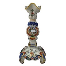 Pair of 19th century Fourmaintraux Freres Desvres faience candlesticks, each decorated with foliate scrolls, flowers, together with a similar later pair of candlesticks, H25.5cm (4)