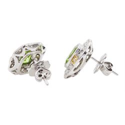 Pair of 18ct white and yellow gold emerald cut peridot and milgrain set round brilliant cut diamond stud earrings, total peridot weight 3.11 carat, total diamond weight 0.70 carat, with World Gemological Institute report