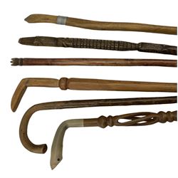 Group of vintage walking hardwood walking sticks and staff, the staff carved in the form of two crocodiles and various others (6)