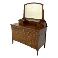 Edwardian mahogany dressing table, raised arch mirror with bevelled plate over trinket drawers, moulded rectangular top with satinwood band, two short of two long drawers, on square supports with brass cups and castors 