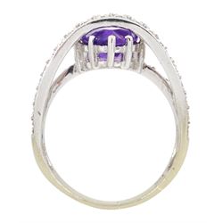 18ct gold amethyst and diamond ring, pear cut amethyst to a diamond set crossover band, stamped 750