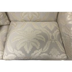 Duresta - Grande hardwood-framed three-seat sofa, upholstered in pale fabric decorated with repeating foliate pattern, on square tapering supports with brass castors 