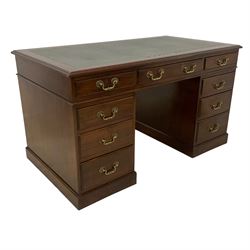 Late 19th century mahogany twin pedestal desk, moulded rectangular top with inset leather, fitted with nine drawers, on plinth base