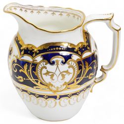 Royal Crown Derby tea service for twelve, circa 1930, comprising twelve teacups, saucers & tea plates, two serving plates, sugar basin and milk jug, each piece decorated with cobalt blue and gilt moulded borders, pattern no. 5732