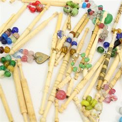 Collection of 19th century and later bone & plastic lace maker's bobbins, mostly with turned shafts, some with brass and metal wire work details, most with glass spangles (99 approx)