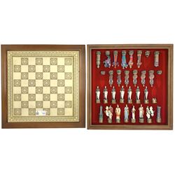 Franklin Mint 'The Great Crusaders' 1989 chess set, with cabinet and ivory resin chess board, 56cm x 56cm, incomplete 