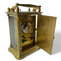 Auguste of Paris - mid-19th century carriage clock in a foliate engraved case with acorn finials and conforming carrying handle, white enamel dial with makers name, Roman numerals, minute track and fine matching steel moon hands,  engraved rear door revealing a twin train going barrel movement striking the hours and half hours on a bell, with the original jewelled lever platform escapement and repeat function, back plate stamped Auguste-Paris, 