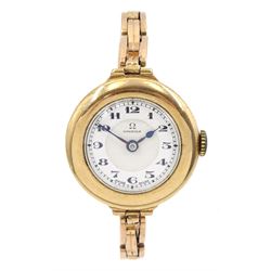 Omega early 20th century 9ct gold manual wind wristwatch, No. 6877301, white enamel dial with Arabic numerals, Birmingham 1927, on expanding gold strap, stamped 9ct