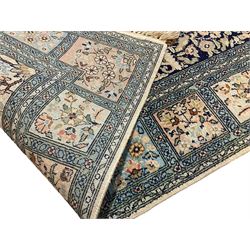 Fine Persian Kashmir ivory and pale indigo ground runner rug, the field decorated with sixteen rectangular panels depicting Mirab motifs and other traditional carpet designs, the border with repeating square panels of floral bouquets and foliate patterns