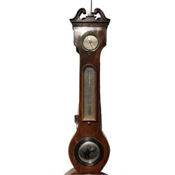 An early 20th century Fitzroy mercury barometer and a late 19th century wheel barometer. Fitzroy barometer with full size charts, storm glass and mercury thermometer, case fitted with adjustable verniers. Five glass mercury wheel barometer in a mahogany case with hygrometer, mercury thermometer, butlers mirror, 8