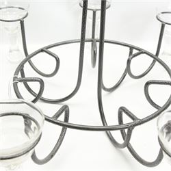 Patinated wrought metal seven-light chandelier with glass candle holders, H72cm