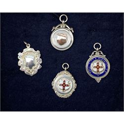 Four 1920s silver fobs, nine silver sporting spoons, six enamel badges, plated trophies etc awarded to F C Charlton and a pewter tankard engraved with all the places he served in WWII