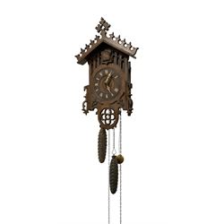 German -  late 19th century Black Forrest weight driven two train cuckoo clock, with carved decoration to the pediment and front of the case, hand carved bone hands and numerals and opening side doors, with a carved cuckoo and original pipes and bellows. With pine cone weights and pendulum.