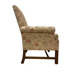 Peter Dudgeon - Georgian design mahogany framed armchair, shaped cresting rail over sprung back and seat flanked by rolled arms, upholstered in floral patterned fabric with matching seat cushion, on square supports joined by stretchers
Provenance: From the Estate of the late Dowager Lady St Oswald