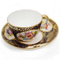 Four early 19th century Spode cups and saucers, two decorated in the Imari palette, pattern no. 2375, and two others, pattern no. 3260 & 1709, together with two early 19th century porcelain rococo revival chambersticks and another Spode tea cup (11)