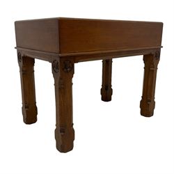 Late Victorian oak bidet stool, rectangular form with lid, shaped ceramic basin, on square chamfered supports carved with flowerhead roundels 