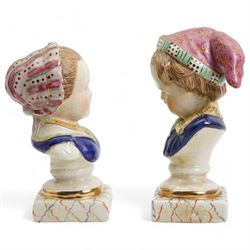 Pair of Staffordshire style busts of a young girl an boy, each upon square marbled bases, H22cm