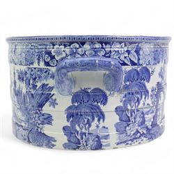 Early 19th century Staffordshire blue and white transfer printed footbath, of oval banded section, the exterior printed with a farmer herding cows down a country lane, the interior with figures and horses before a ruin, within floral borders, L52cm, H21cm, W36cm