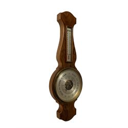 20th century aneroid barometer in a walnut veneered case.