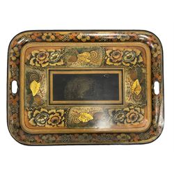 19th century tole ware tray of rectangular form, decorated with Japanese inspired floral motifs and gilt shells, with pierced handles, the associated ebonised and gilt stand, raised on ring turned splayed supports united by X-stretcher, decorated with gilt foliage