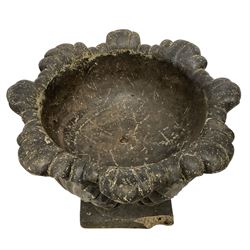 Composite stone floral shaped urn, decorated with relief overlapping anthemion leaves, on square base, in black painted finish