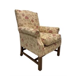 Peter Dudgeon - Georgian design mahogany framed armchair, shaped cresting rail over sprung back and seat flanked by rolled arms, upholstered in floral patterned fabric with matching seat cushion, on square supports joined by stretchers
Provenance: From the Estate of the late Dowager Lady St Oswald