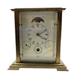 French - 20th century 8-day brass cased table clock, with five bevelled glass panels and multi-dial recording the time, date ,day, month and phases of the moon, with a twin train rack striking movement and platform lever escapement, striking the hours and half hours on a bell.