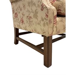 Peter Dudgeon - Georgian design mahogany framed armchair, shaped cresting rail over sprung back and seat flanked by rolled arms, upholstered in floral patterned fabric with matching seat cushion, on square supports joined by stretchers
Provenance: From the Estate of the late Dowager Lady St Oswald