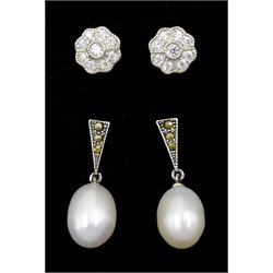 Pair of silver marcasite and pearl pendant stud earrings and a pair of silver cubic zirconia flowerhead stud earrings