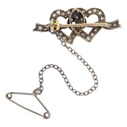 Late 19th century silver and gold, old cut diamond double heart brooch, two entwined hearts tied by a ribbon and set throughout with old cut and rose cut diamonds, total diamond weight 0.25 carat