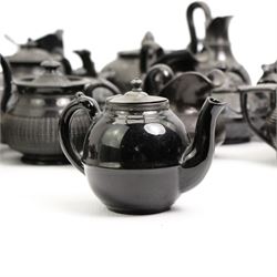 Early 19th century and later black basalt tea wares and similar stoneware, mostly with relief or engine turned bodies, including bachelors teapots, milk jugs, sucriers etc, in one box