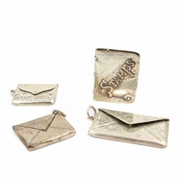 Silver trough shape double stamp box W5.5cm, three silver envelope design stamp boxes and two other small silver boxes (6) 