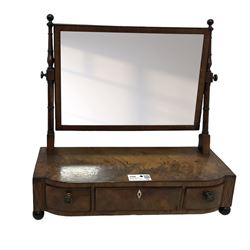 George III mahogany toilet mirror, rectangular plate on ring turned supports with swing action, three drawers with simulated ivory escutcheon, on ebonised bun feet