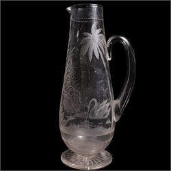 19th/ early 20th century crystal water jug, probably Stourbridge, of baluster form engraved with two Swans on a lake, amongst ferns, reeds and a palm tree, on circular pedestal star engraved foot, H28cm, heavy cut glass jar and cover on pedestal foot, together with a Lalique Samoa frosted glass scent bottle, signed Lalique, France, and labelled 11312 H8cm (3)