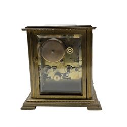 French - 20th century 8-day brass cased table clock, with five bevelled glass panels and multi-dial recording the time, date ,day, month and phases of the moon, with a twin train rack striking movement and platform lever escapement, striking the hours and half hours on a bell.