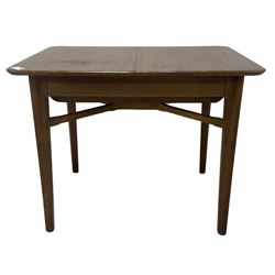 Mid-20th century teak extending dining table, rectangular top with rounded corners, raised on shaped tapering supports united by X-stretcher, with additional leaf