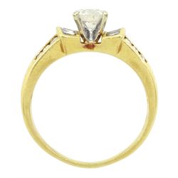 18ct gold round brilliant cut diamond ring, with channel set tapered baguette and round brilliant cut diamond shoulders, stamped, principal diamond weight approx 0.75 carat, total diamond weight approx 1.15 carat