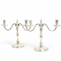 Pair of 18th century design silver two branch candelabra with baluster stems on dished circular foot H24cm London 1965 Maker Solomon Joel Phillips (S J Phillips)