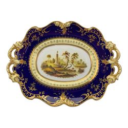 Early 19th century Ridgway twin handled oval dish, hand painted with figures in a river landscape, within a cobalt blue and moulded border, L30cm together with a similar twin handled serving dish, L28cm (2)