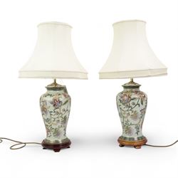 Pair of Chinese pottery table lamps with shades, on hardwood stands, H70cm overall 