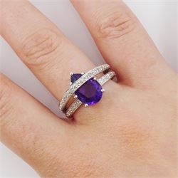 18ct gold amethyst and diamond ring, pear cut amethyst to a diamond set crossover band, stamped 750